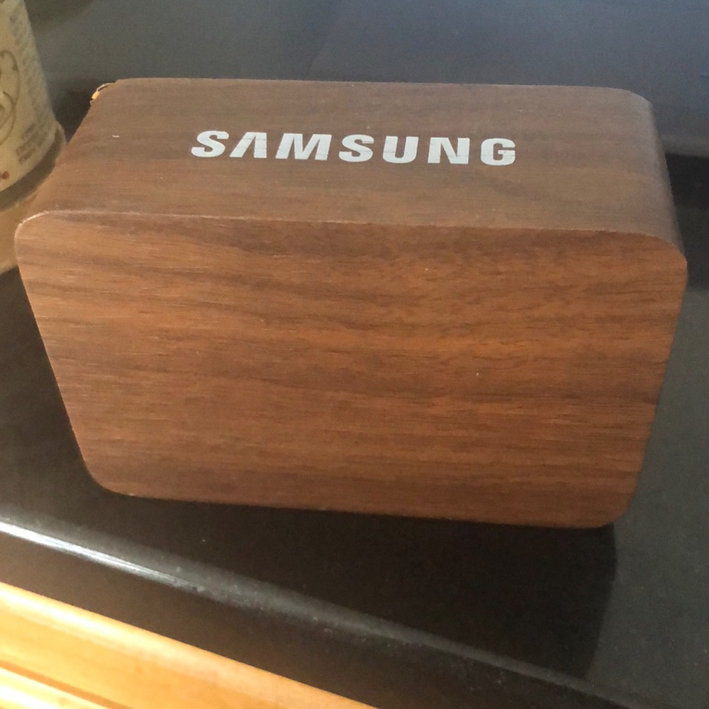 Clock with light up letters wood says Samsung on